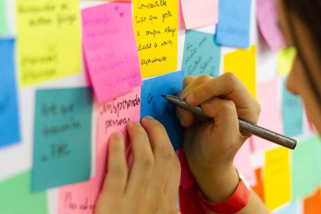 Person Writing on Sticky Notes